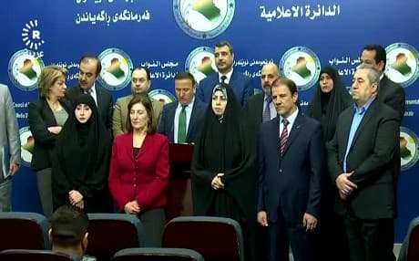 Kurdish MPs in a joint statement at parliament in Baghdad on February 17, 2018, condemn the beatings of two tourists from Basra. MPs from Basra are also present. Photo: Rudaw TV