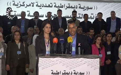 Havrin Khalaf and Ibrahim al-Qaftan of the newly formed Future Syria Party speak in Raqqa on Wednesday. Photo: Rudaw TV