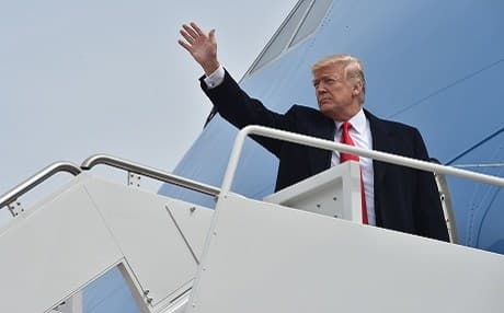 US President Donald Trump waves as he boards Air Force One at Andrews Air Force Base in Maryland on his way to Ohio on Thursday. Photo: Nicholas Kamm/AFP