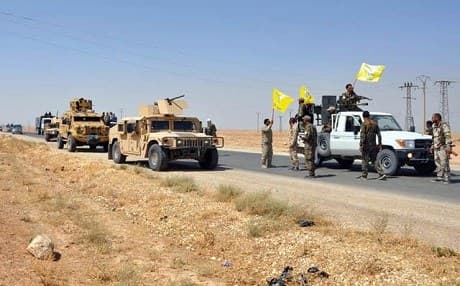 SDF fighters ride in armoured vehicles south of Hasaka in August 2017. File photo: AFP