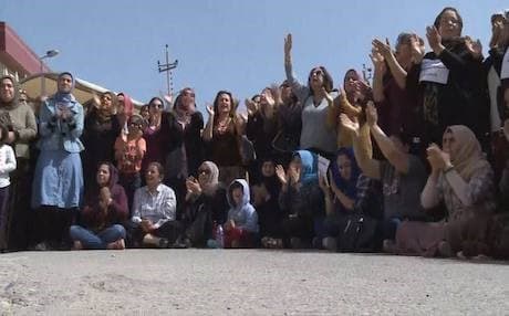 Health workers staging a strike outside the Sulaimani Teaching Hospital on March 31, 2018, demanding an end to the salary saving system, as a condition to resume work, despite the KRG easing down the unpopular pay cuts system. Photo: Rudaw TV