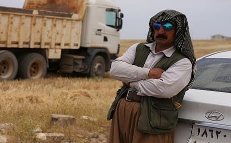 A Kurdish wheat farmer stands in his field in the Kurdistan Region. File photo: Rudaw