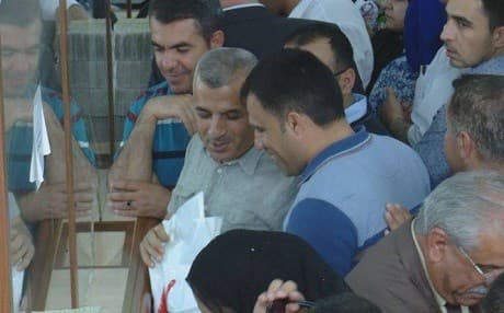 Public sector employees collect their wages at a bank in Erbil on Thursday. Photo: Rudaw