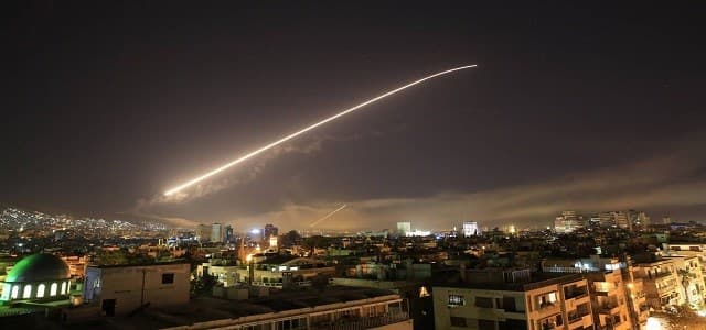 The Damascus sky lights up with surface-to-air missile fire as the US and allies target different parts of the capital early on April 14, 2018. Photo: Hassan Ammar | AP