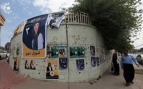 A man walks past campaign posters in Sulaimani. Photo: Sartip Othman/Rudaw