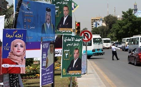 Campaign posters for candidates in the upcoming Iraqi parliamentary elections are seen in Baghdad on April 19, 2018. Photo: Ahmad al-Rubaye | AFP