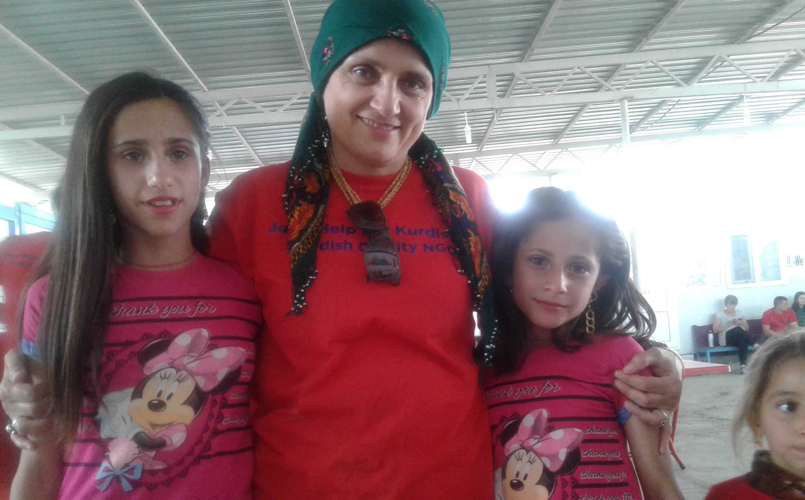 Dr. Nemam Ghafouri embraces two Yezidis who have been displaced since August 2014. Photos by author