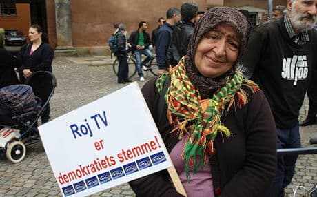 A demonstrator in Denmark protests court decision against Roj TV. Photo: Deniz Serinci