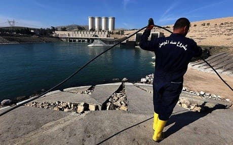 An employee works on Mosul dam. File photo: AFP
