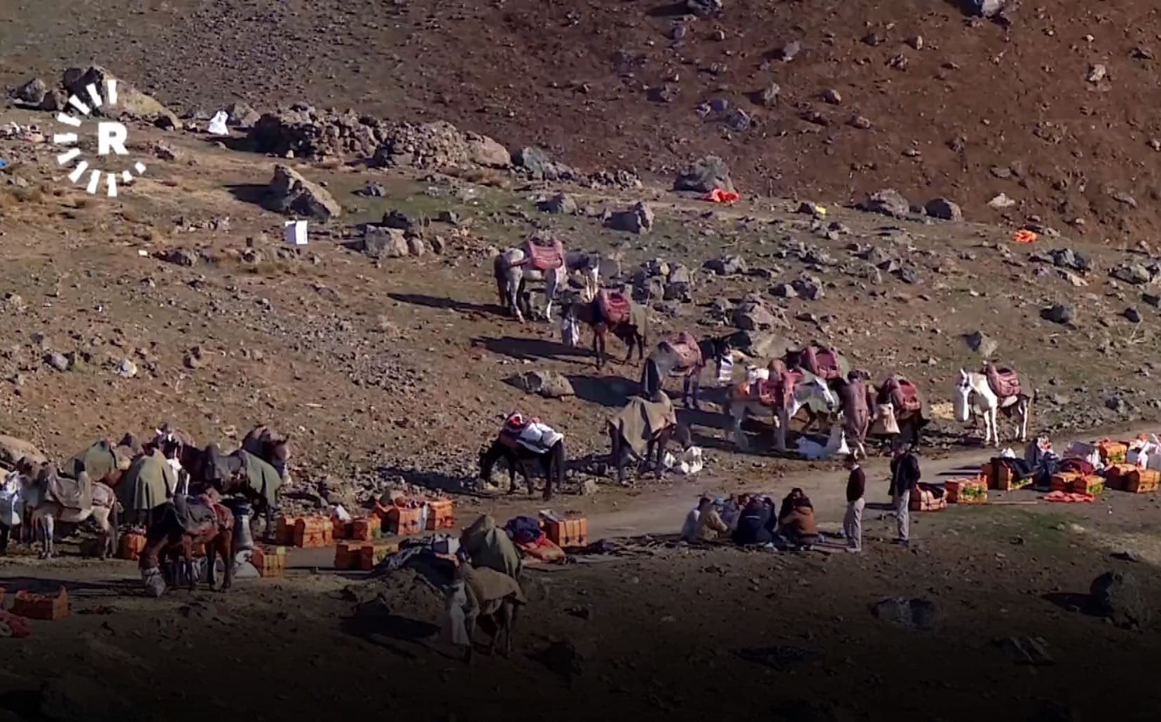 Kolbars are semi-legal porters who carry goods on their backs across the Kurdistan Region-Iran border. Photo: Rudaw
