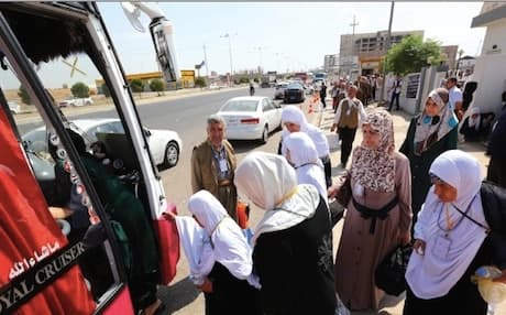 Kurdish pilgrims board a bus on the first leg of their journey to Mecca. Photo: Rudaw 