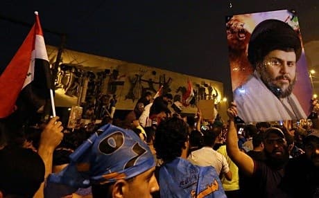 Supporters of Muqtada al-Sadr celebrate his election victory in Baghdad on May 14. Photo: Hadi Mizban/AP