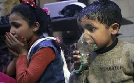 Child receives oxygen through respirators following an alleged poison gas attack in the rebel-held town of Douma, near Damascus, Syria. Photo: Syrian Civil Defense White Helmets / AP
