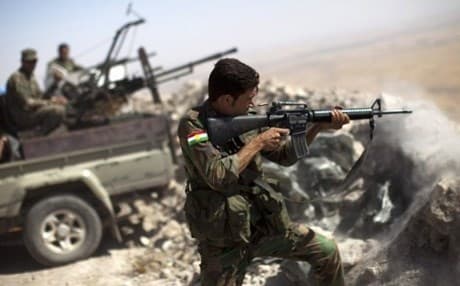 Illustrative photo of a Kurdish peshmerga fighter firing at Islamic State positions. AFP file Photo
