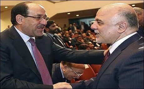 Nouri al-Maliki (L) shakes hands with Haider al-Abadi in 2014. Photo: AP/file