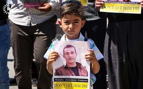 A child holds a poster appealing for the life of Ramin Hassan Panahi at a protest at the UN compound in Erbil earlier this year. Panahi was executed by Iran on September 8, 2018. File photo: Mohammed Shwani/Rudaw