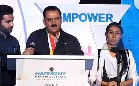 Yezidi survivors Layla Taalo (R) and Idris Bashar Silo Taha (C) accept Mother Teresa Awards for social justice during ceremony in Mumbai, India, October 21, 2018. Photo: Rudaw video