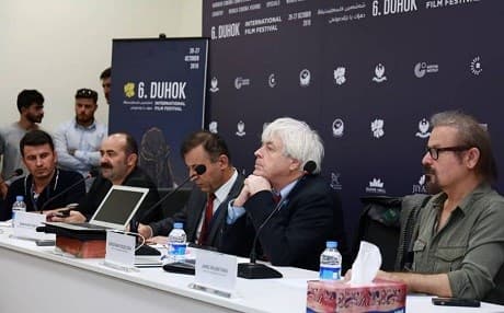 Dr. Yilmaz Ozdil, Kristian Feigelson, Babaker Dreyi, and Jano Rojbeyani discuss Filmmaking in War Time at Duhok International Film Festival. Photo: DIFF