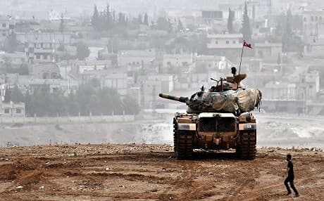 A Turkish tank near the border with the Syrian Kurdish city of Kobani. AFP file photo.