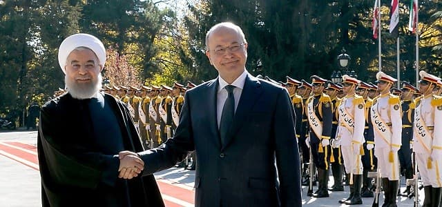 Iranian President Hassan Rouhani shakes hands with his Iraq counterpart Barham Salih in Tehran on Saturday morning. Photo: Iranian presidency via AFP