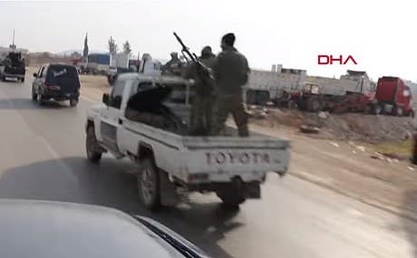 Turkish-backed Syrian militias drive into al-Bab. Photo: DHA video