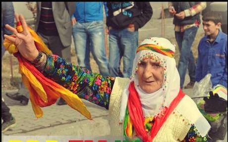 A woman displays the colors of the Kurdish flag in Turkey’s municipal elections. Photo: BDP