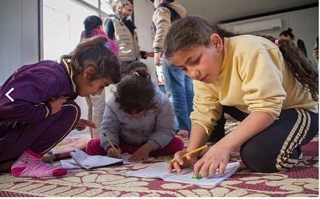 Displaced children play in a camp. Photo: Save the Children