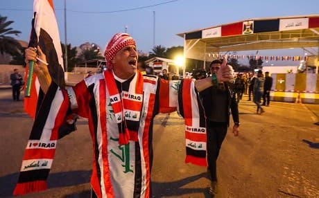 An Iraqi man decked out in the national flag celebrates the re-opening of Baghdad's Green Zone on December 10, 2018. Iraq's population was last counted in 1997. Photo: Ahmad al-Rubaye/AFP