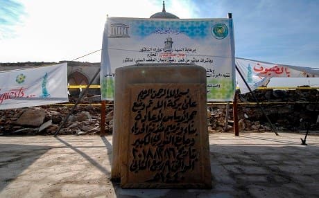 A picture taken on December 16, 2018, shows the cornerstone placed as part of a ceremony for the rebuilding of the Great Mosque of Al-Nuri and "Al-Hadba" leaning minaret in Mosul’s war-ravaged Old City. Photo: Zaid al-Obeidi | AFP
