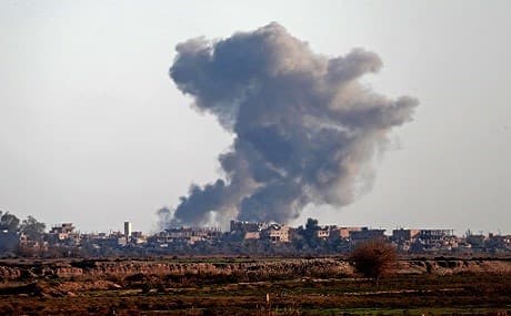 Smoke billows after bombings in the Deir ez-Zor province, near Hajin, eastern Syria, December 15, 2018. Photo: Delil Souleiman / AFP