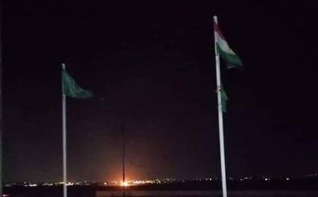 The Kurdistan flag flies next to the banner of the Patriotic Union of Kurdistan (PUK) at their offices in Kirkuk. Photo: PUK 