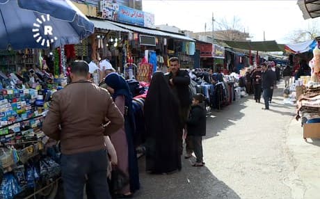People walk through a bazaar in Chamchamal. Photo: Rudaw TV