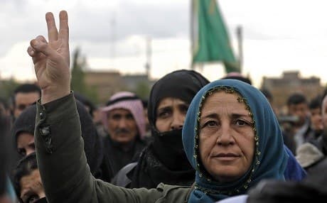 A woman gestures during the funeral of an Arab fighter from the Syrian Democratic Forces (SDF) in Qamishli on January 18, 2019. Photo: Delil Souleiman/AFP