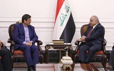 Iraqi Prime Minister Adil Abdul-Mahdi (R) meets with head of Iran’s Central Bank Abdul Naser Hemmati. Photo: PM office
