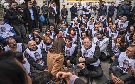Members and co-chairs of HDP Sezai Temelli (centre right) and Pervin Buldan (centre left) stage a protest in solidarity with MP Leyla Guven, on hunger strike since November 8, near Istanbul's Taksim square on February 11, 2019. Photo: Ozan Kose/AFP