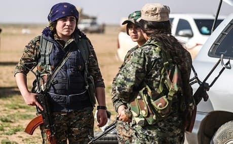 SDF fighters gather at a scanning area near al-Baghouz, Syria, in Deir ez-Zor governorate on February 25, 2019. Photo: Delil Souleiman | AFP