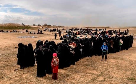 People are evacuated from the ISIS embattled holdout of al-Baghouz wait at a screening area held by the SDF in Deir ez-Zor on March 5, 2019. File photo: Bulent Kilic | AFP