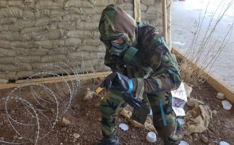 Peshmerga officer tests soil for chemical weapons' residue during a training exercise in Erbil. Photo: Islam Askandar Zebari