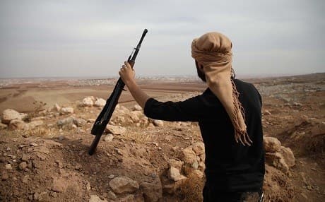 A Syrian rebel-fighter with the National Liberation Front (NLF) watches towards the regime areas in northwestern countryside of Aleppo province on October 9, 2018. File photo: Aaref Watad / AFP