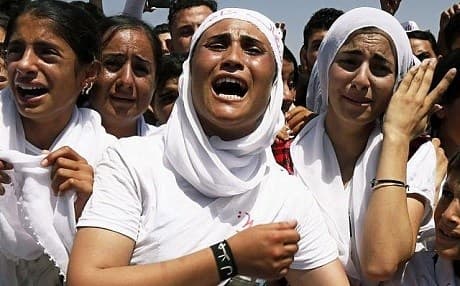 Yezidi women chant slogans during a protest against the Islamic State (ISIS) group's invasion of Shingal (Sinjar) city, on August 3, 2015. File photo: Seivan M. Salem