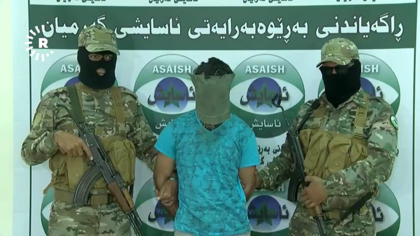 A man stands at a press conference in Kalar, Kurdistan Region, after Garmiyan Asayesh say he confessed to aiding Islamic State (ISIS) members. Photo: Rudaw TV