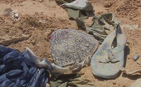 Kurdish-style clothing lies exposed at the site of a suspected mass grave in Muthanna province, southern Iraq, April 13, 2019. Photo: Rudaw TV