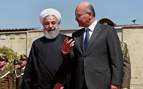 Iraqi President Barham Salih (R) walks with visiting Iranian President Hassan Rouhani before their meeting at Salam Palace in Baghdad, Iraq, March 11, 2019. File photo: Khalid Mohammed / AP