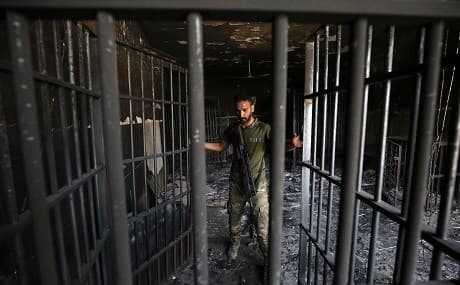 An Iraqi officer inspects a prison cell, June 30, 2016. File photo: Ahamd Al-Rubaye / AFP