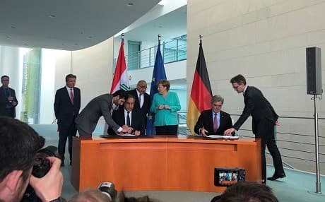 Iraqi PM Adil Abdul-Mahdi (back row, left) and German Chancellor Angela Merkel (back row, right) look on as Iraq’s Electricity Minister Luay al-Khateeb (left) and Siemens AG President Joe Kaeser (right) sign an implementation agreement in Berlin on April 30, 2019. Photo: Zinar Shino/Rudaw
