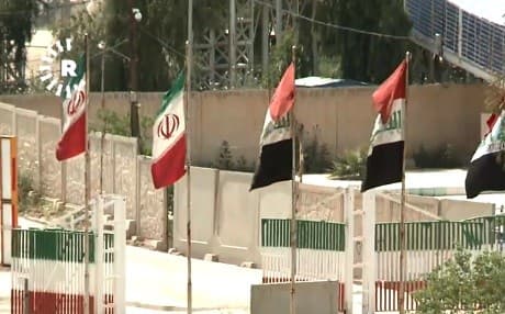Iraqi and Iranian flags fly at the Parviz-Khan border crossing between Iran and the Kurdistan Region. Photo: Rudaw
