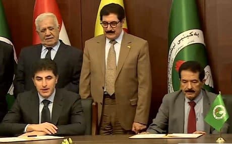 KDP deputy leader Nechirvan Barzani (L) and PUK acting leader Kosrat Rasul sign new agreement on government formation in Sulaimani, May 5, 2019. Photo: Rudaw TV