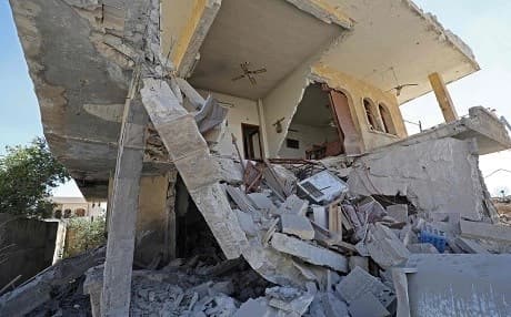 A picture taken on May 10, 2019 shows a building destroyed by reported shelling by government forces on the town of Khan Sheikhun in the southern countryside of the rebel-held Idlib province. Photo: Omar Haj Kadour | AFP