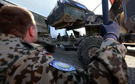In this file photo taken on February 18, 2016 German military experts work on an army vehicle at a workshop for Peshmerga forces in Erbil. File photo: Safin Hamed/AFP