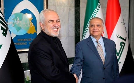 Iraqi Foreign Minister Mohammad Ali al-Hakim (R) greets Iran's Foreign Minister Mohammad Javad Zarif in Baghdad, May 26, 2019. Photo: Sabah Arar / AFP 